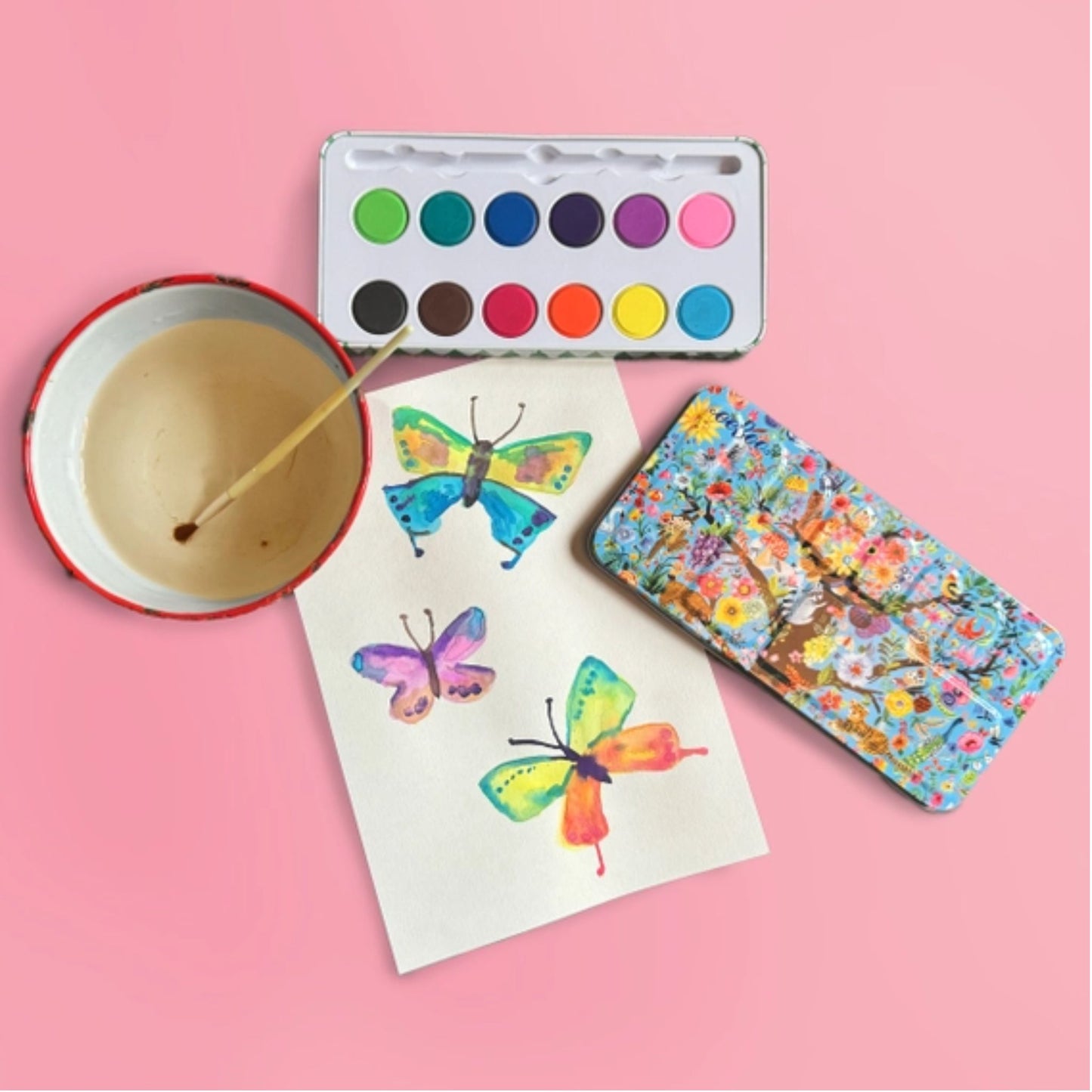 colorful watercolors paint set with brush