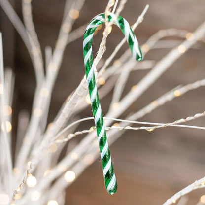 Green and White striped candy cane glass ornament