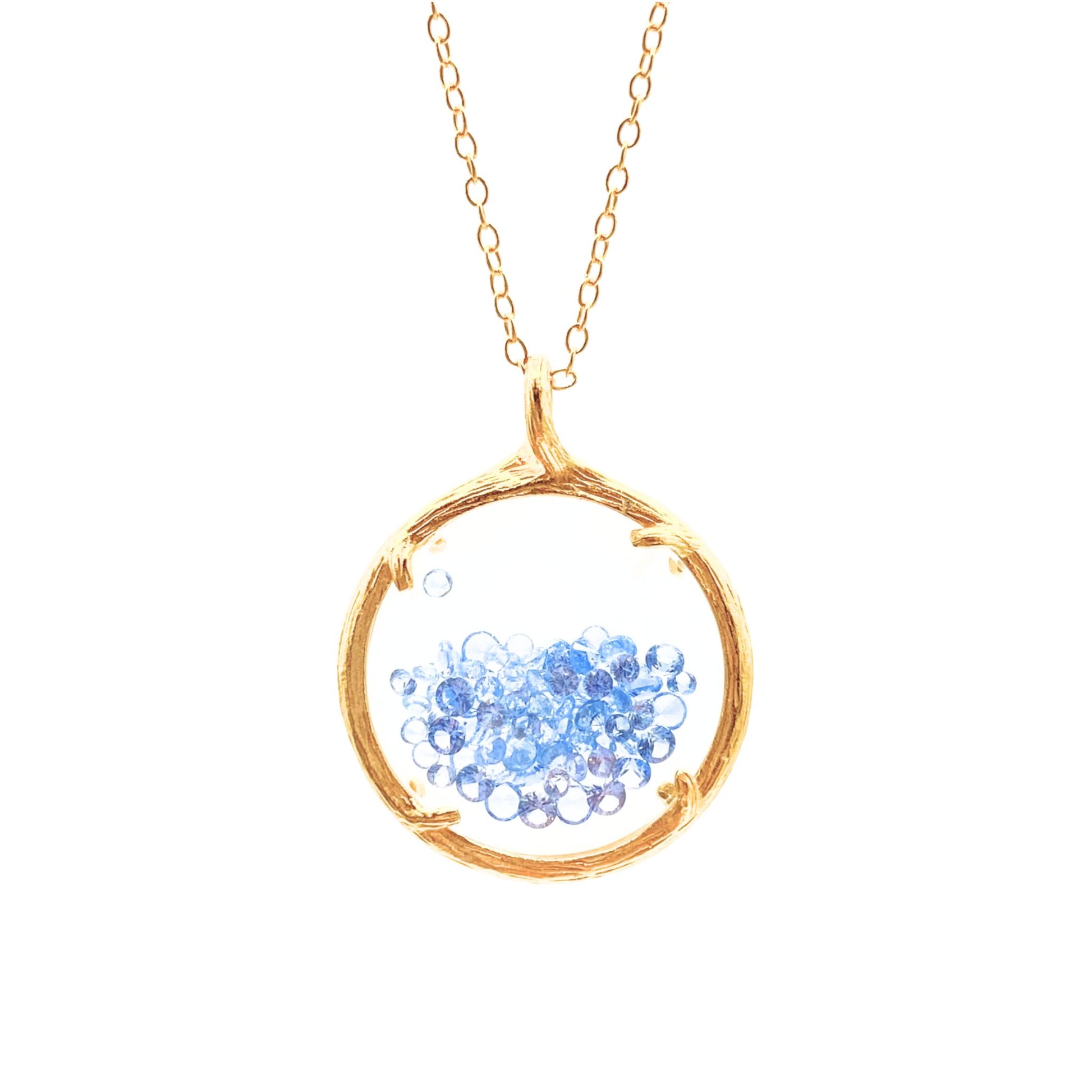 Shaker circle gold necklace with light blue crystals